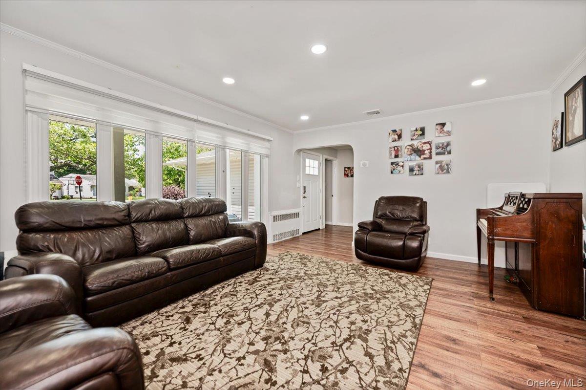 534 Allen Road Woodmere, NY 11598 - Photo 4 of 35 a living room with furniture and a fireplace