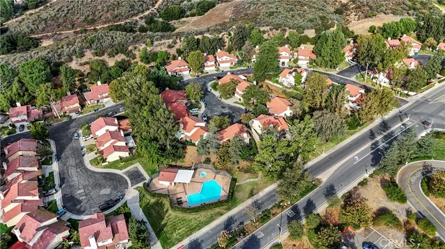 an aerial view of residential houses with outdoor space