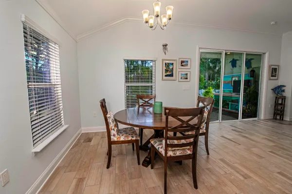 a view of a dining room with furniture and window