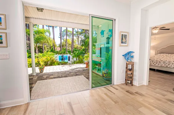 a view of livingroom with furniture and garden