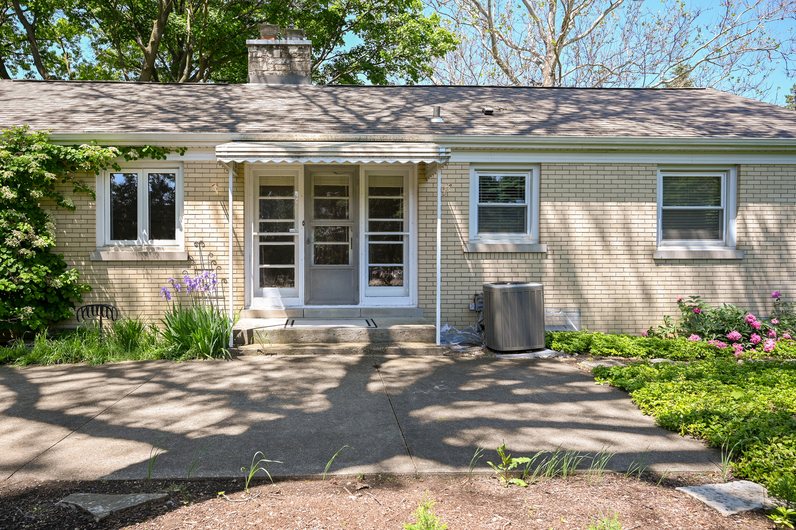 325 South Lambert Road Glen Ellyn, IL 60137 - Photo 27 of 32 a front view of a house with garden