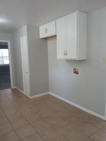 an empty room with cabinet
