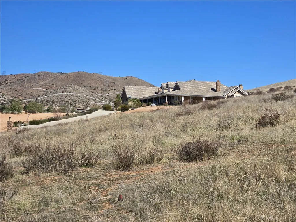 0 White Feather Road Acton, CA 93510 - Photo 13 of 24 a view of a dry yard with mountains in the background