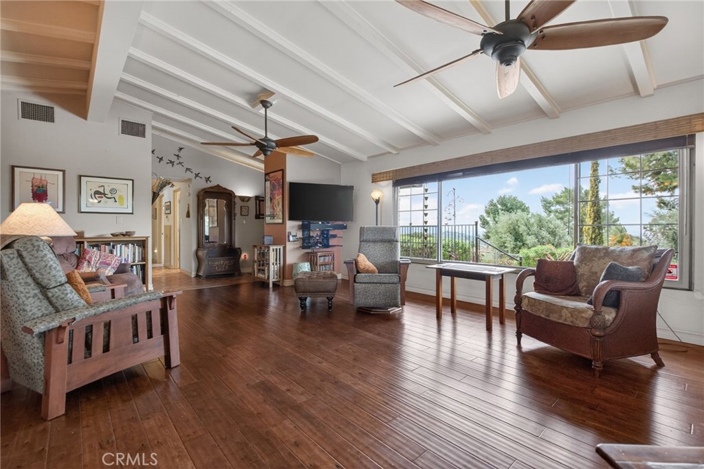 11543 Tulane Avenue Riverside, CA 92507 - Photo 15 of 49 Two large ceiling fans help keep the room cool, while all the windows are double-paned, enhancing the energy efficiency of the entire home.