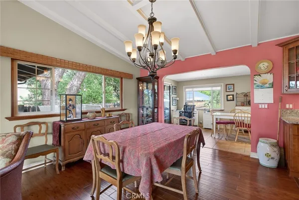 a kitchen with granite countertop a sink and cabinets
