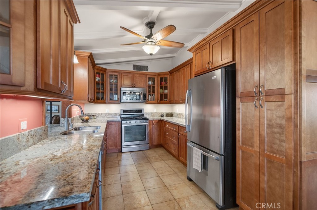 11543 Tulane Avenue Riverside, CA 92507 - Photo 20 of 49 There is a large pantry cabinet with pull out shelving.