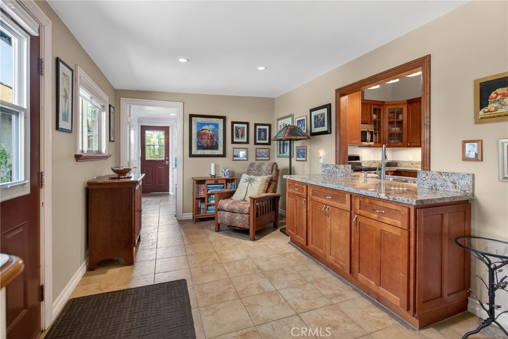 11543 Tulane Avenue Riverside, CA 92507 - Photo 21 of 49 The kitchen granite counters and cabinetry seamlessly flow into the family room.