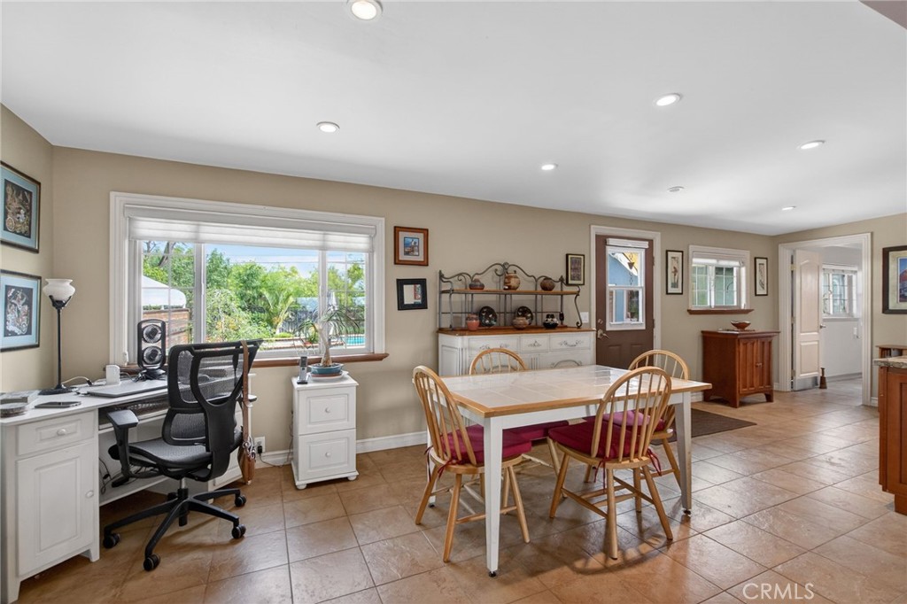 11543 Tulane Avenue Riverside, CA 92507 - Photo 23 of 49 Again, large windows bring light into the space. The door to the backyard is here. The laundry room is to the right.