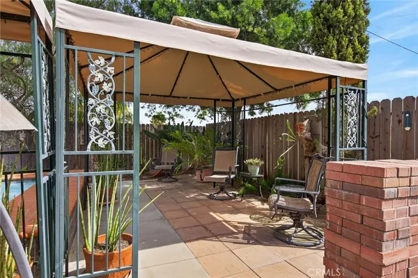 swimming pool view with a garden space