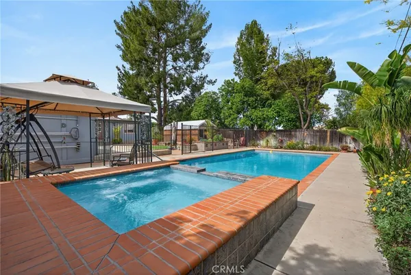 a view of a swimming pool with a lounge chairs