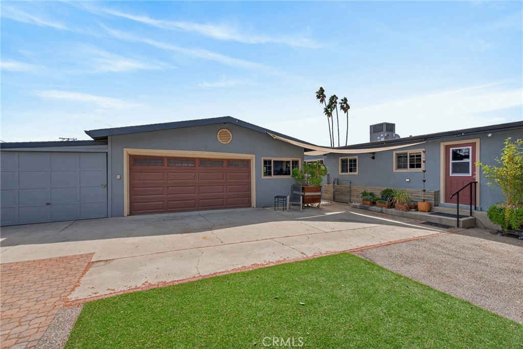 11543 Tulane Avenue Riverside, CA 92507 - Photo 43 of 49 This view showcases the double car and single car garages. The windows on the right are part of the additional studio space.