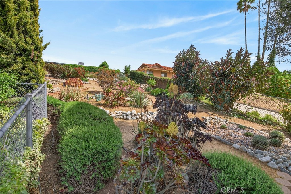 11543 Tulane Avenue Riverside, CA 92507 - Photo 45 of 49 The front gardens make excellent use of the hill, providing pathways and beautiful desert landscaping.