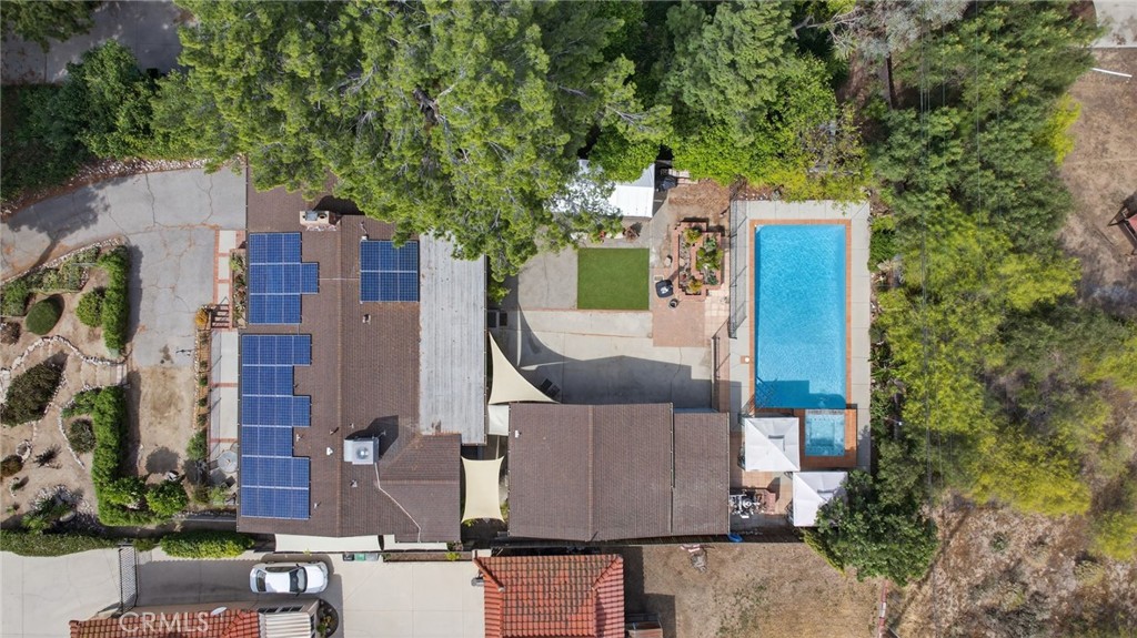 11543 Tulane Avenue Riverside, CA 92507 - Photo 48 of 49 This view showcases the solar panels installed on the home, and providing a comprehensive overview of the property’s layout.