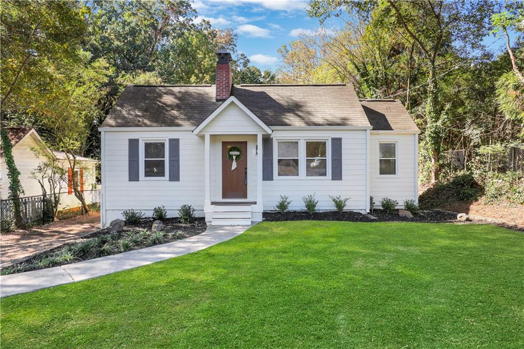 207 Walthall Street Marietta, GA 30064 - Photo 12 of 42 a front view of a house with a garden