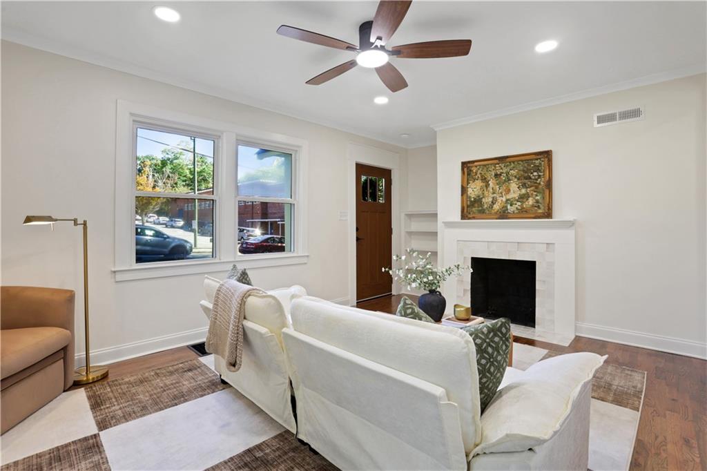 207 Walthall Street Marietta, GA 30064 - Photo 14 of 42 a living room with furniture a fireplace and a large window