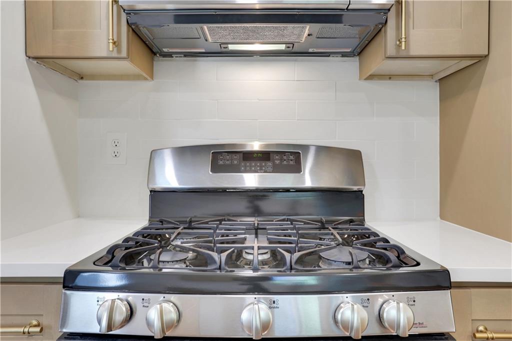 207 Walthall Street Marietta, GA 30064 - Photo 21 of 42 a stove top oven sitting inside of a kitchen