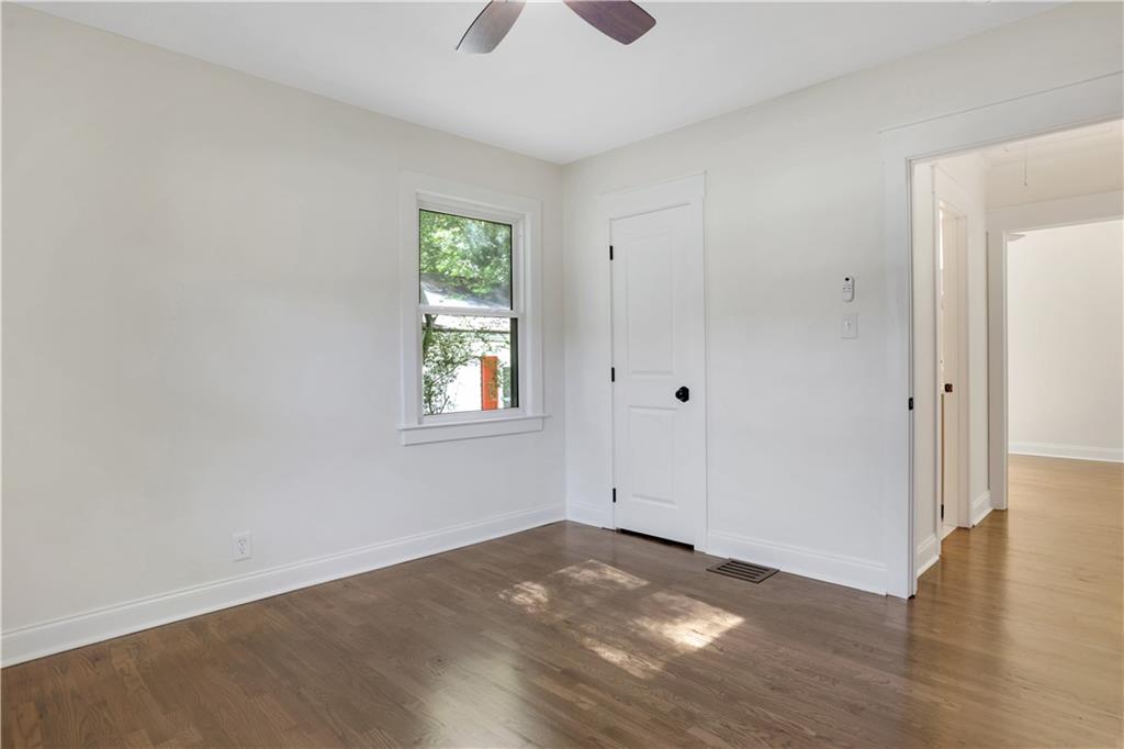 207 Walthall Street Marietta, GA 30064 - Photo 31 of 42 an empty room with wooden floor and windows