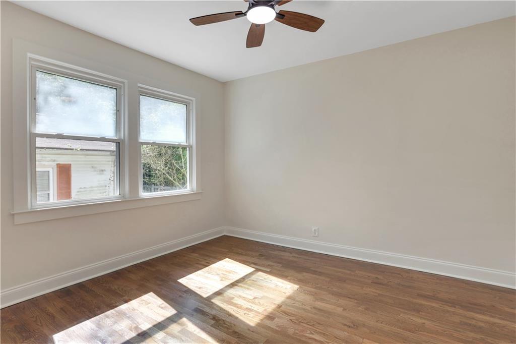 207 Walthall Street Marietta, GA 30064 - Photo 32 of 42 wooden floor in an empty room with a window