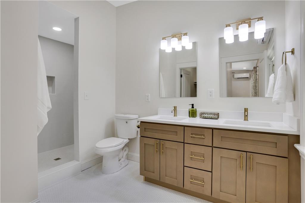 207 Walthall Street Marietta, GA 30064 - Photo 5 of 42 a bathroom with a toilet sink and mirror
