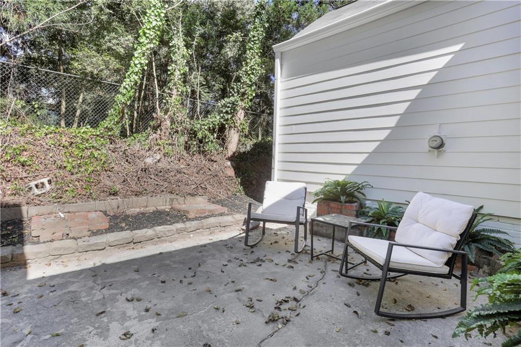 207 Walthall Street Marietta, GA 30064 - Photo 6 of 42 a view of a chairs and table in the back yard
