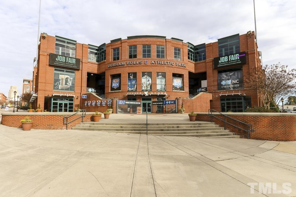 709 Spoonbill Trail Durham, NC 27703 - Photo 38 of 39 a large building with a street