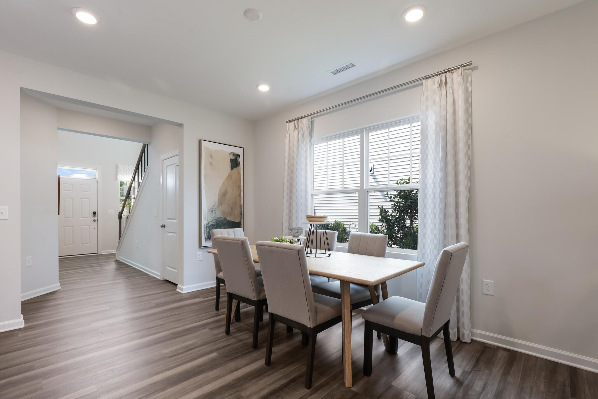 709 Spoonbill Trail Durham, NC 27703 - Photo 5 of 39 a view of a dining room with furniture and wooden floor