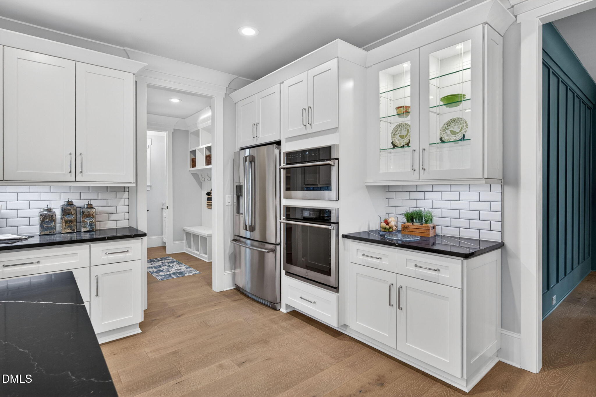 3417 Edgemont Drive Raleigh, NC 27612 - Photo 14 of 83 a kitchen with white cabinets and stainless steel appliances
