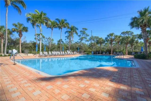 a view of swimming pool a garden and mountain view