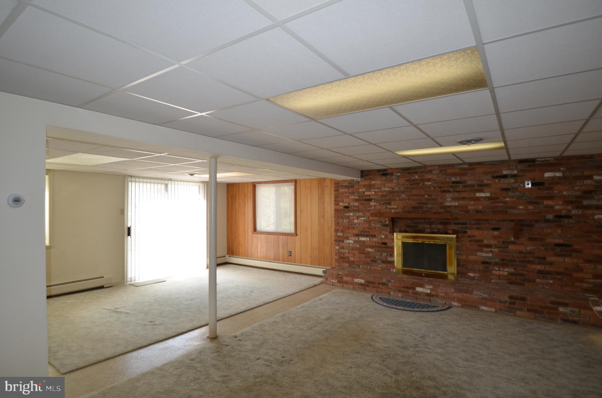 15930 Woods Center Road Silver Spring, MD 20906 - Photo 16 of 33 Lower level rec room