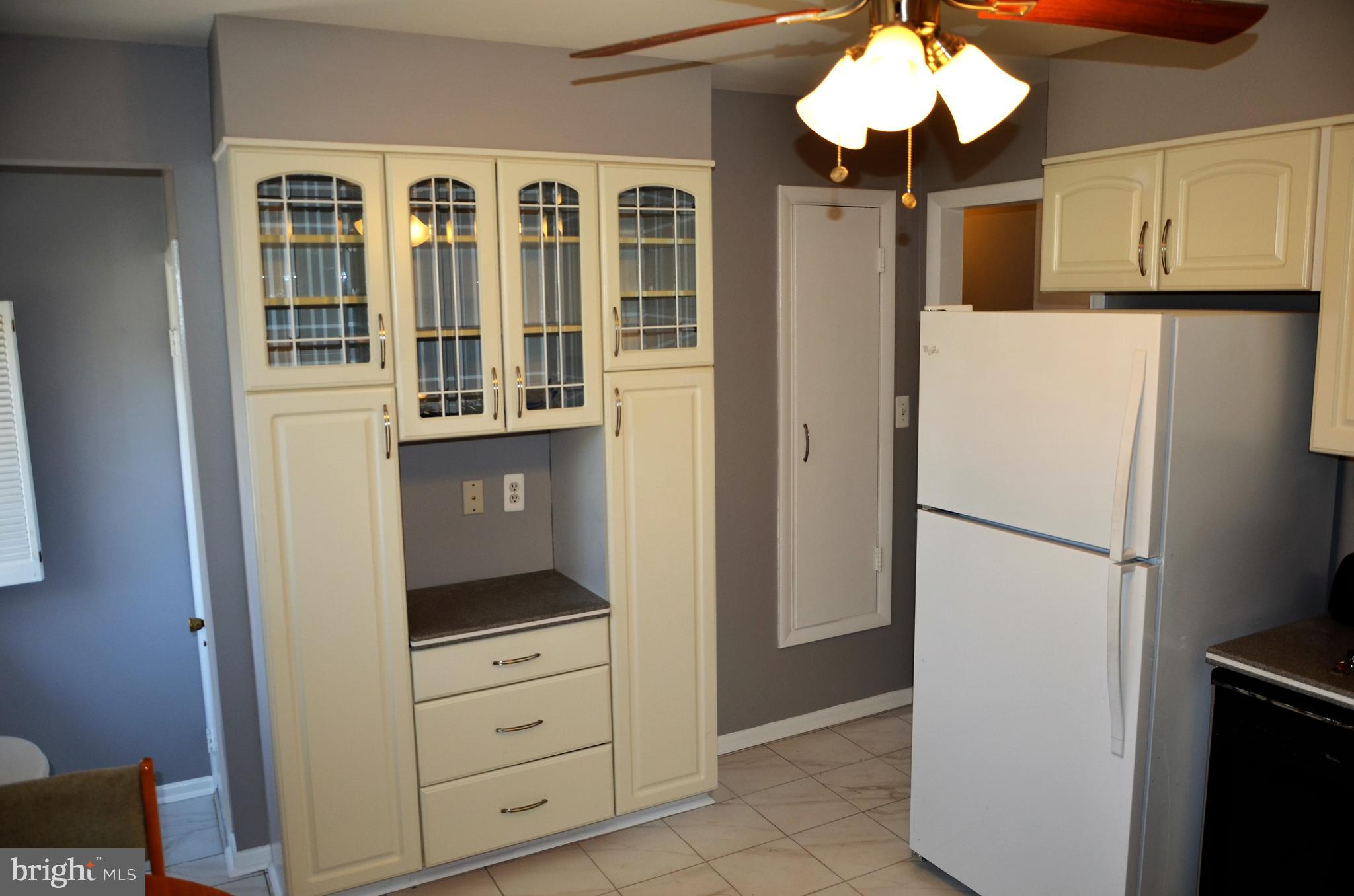15930 Woods Center Road Silver Spring, MD 20906 - Photo 3 of 33 Beautiful whiete kitchen with new tile floor