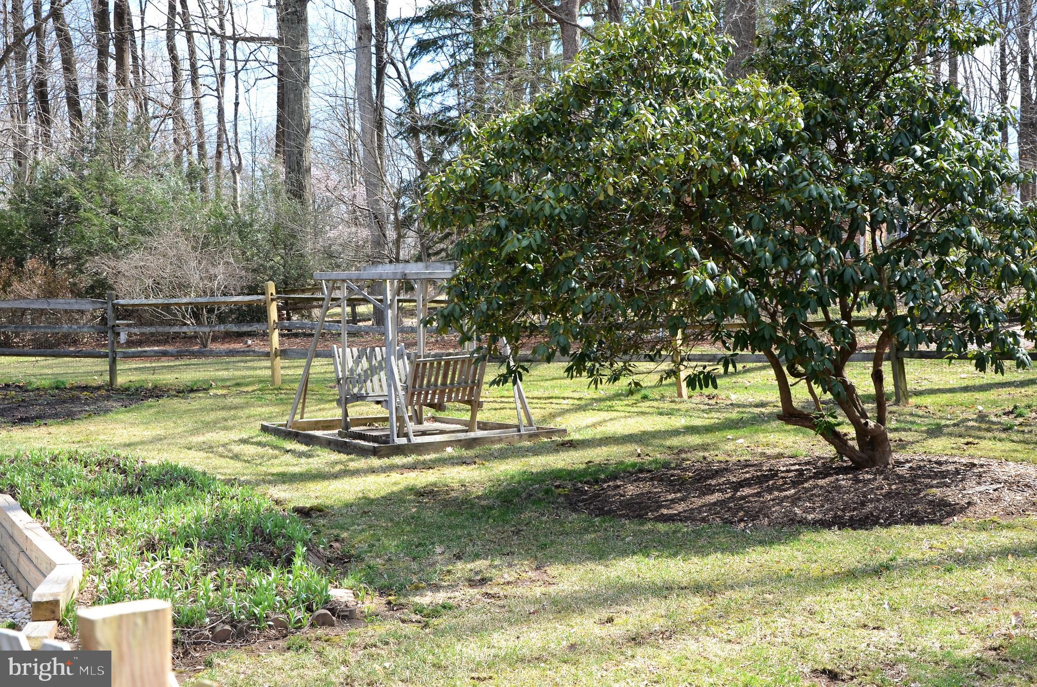 15930 Woods Center Road Silver Spring, MD 20906 - Photo 26 of 33 Relax in this magnificent yard on the wood swing