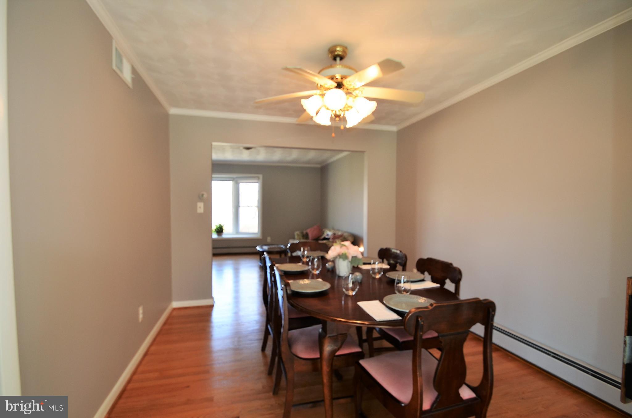 15930 Woods Center Road Silver Spring, MD 20906 - Photo 7 of 33 Formal dining room w/crown molding & hardwood