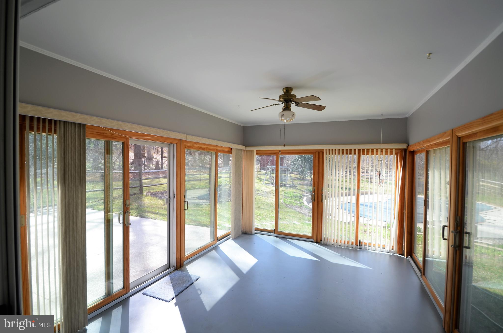 15930 Woods Center Road Silver Spring, MD 20906 - Photo 8 of 33 Sunroom that leads to private backyard