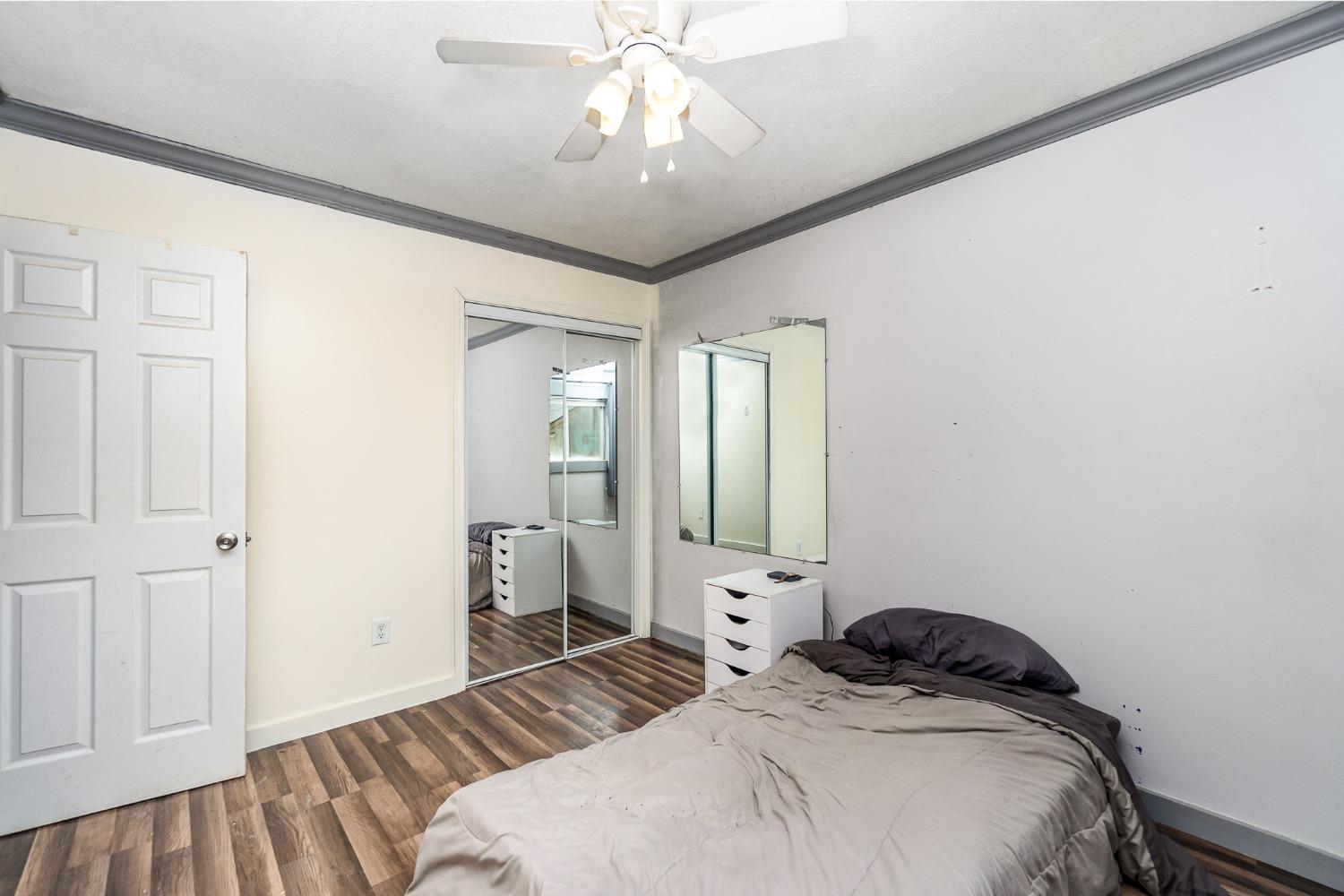 704-3 Juniper Road Valparaiso, IN 46385 - Photo 13 of 24 a bedroom with a bed and a chandelier