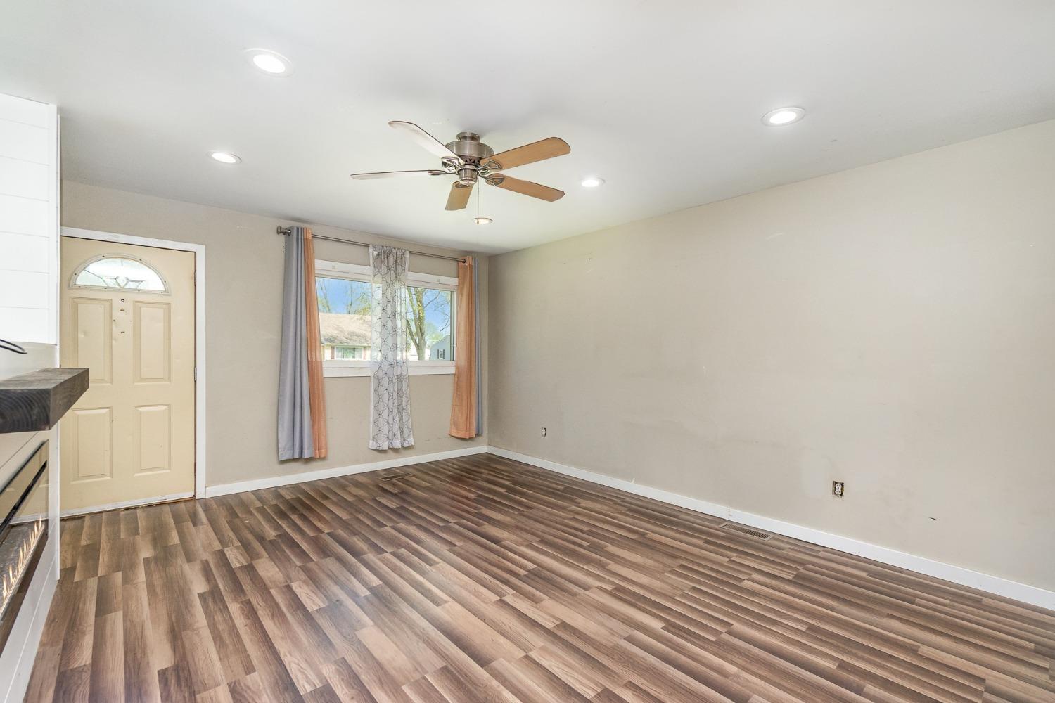 704-3 Juniper Road Valparaiso, IN 46385 - Photo 7 of 24 a view of empty room with wooden floor and fan