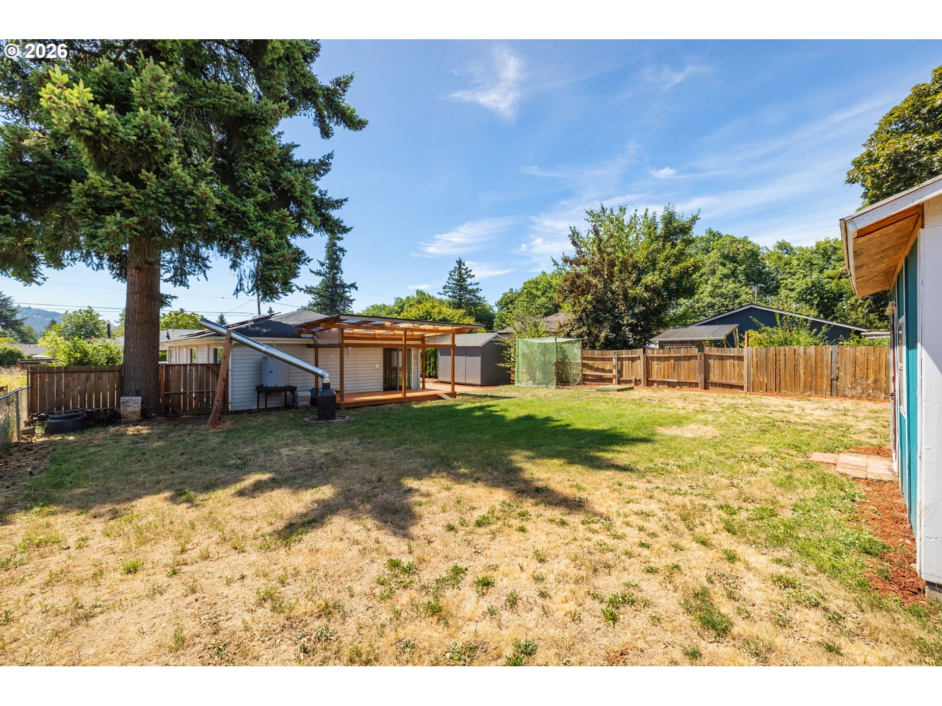 10245 Southeast Raymond Street Portland, OR 97266 - Photo 25 of 25 a view of a yard with a house and a big yard