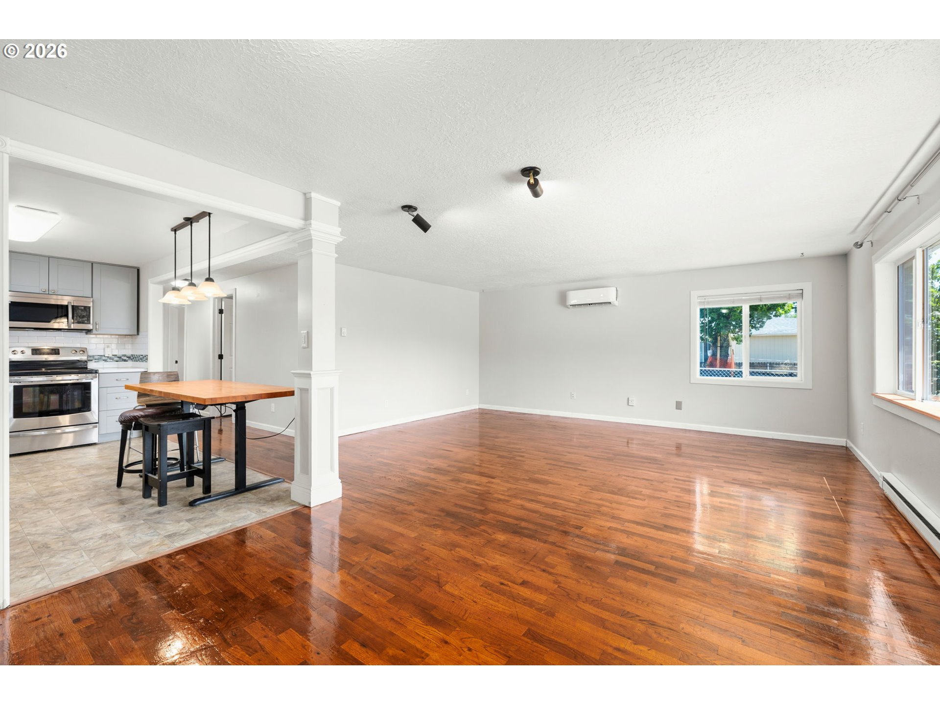 10245 Southeast Raymond Street Portland, OR 97266 - Photo 4 of 25 a view of kitchen with furniture and wooden floor