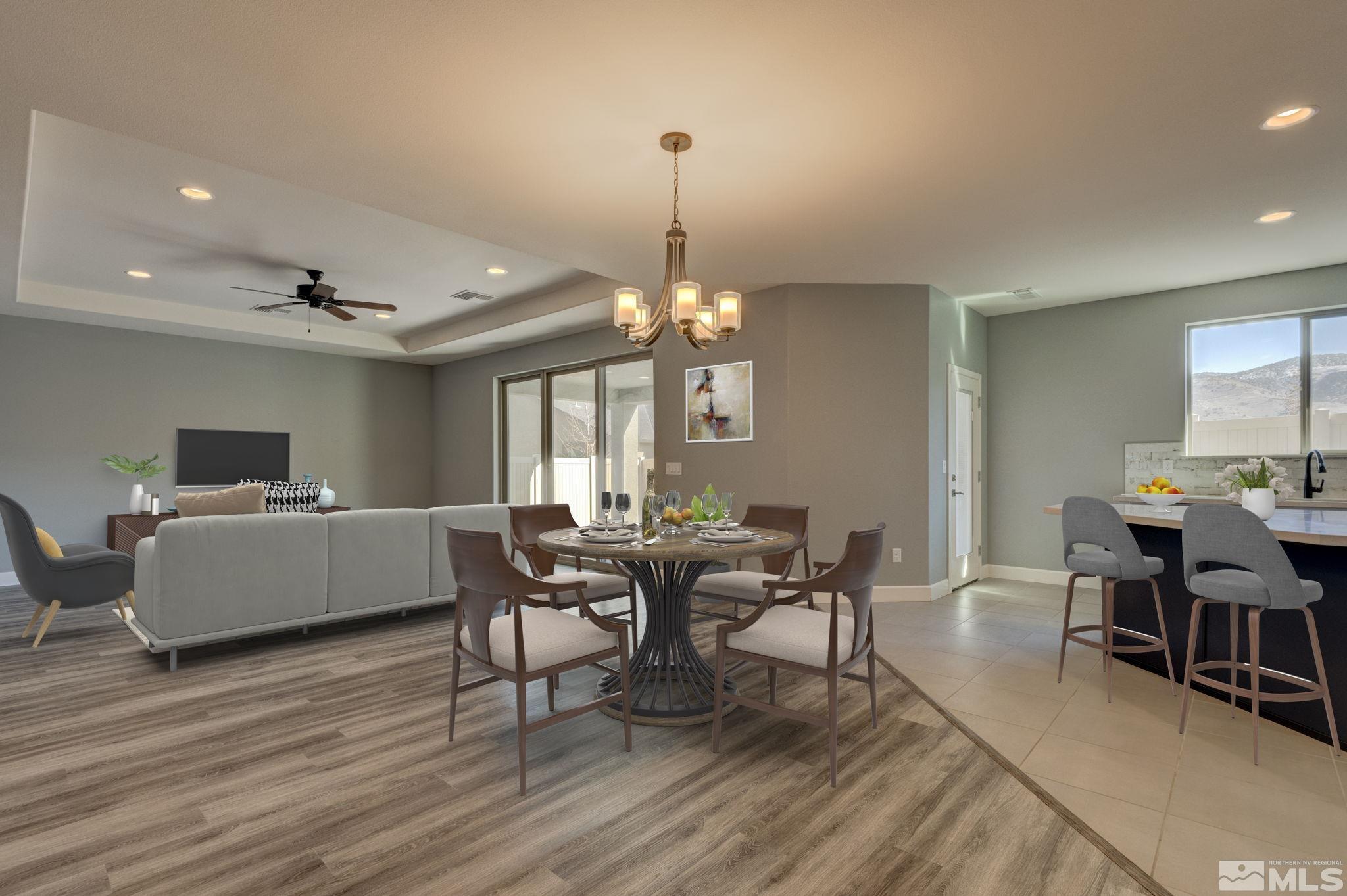 607 Riverbed Circle Reno, NV 89521 - Photo 12 of 40 a dining room with wooden floor a chandelier a wooden table and chairs
