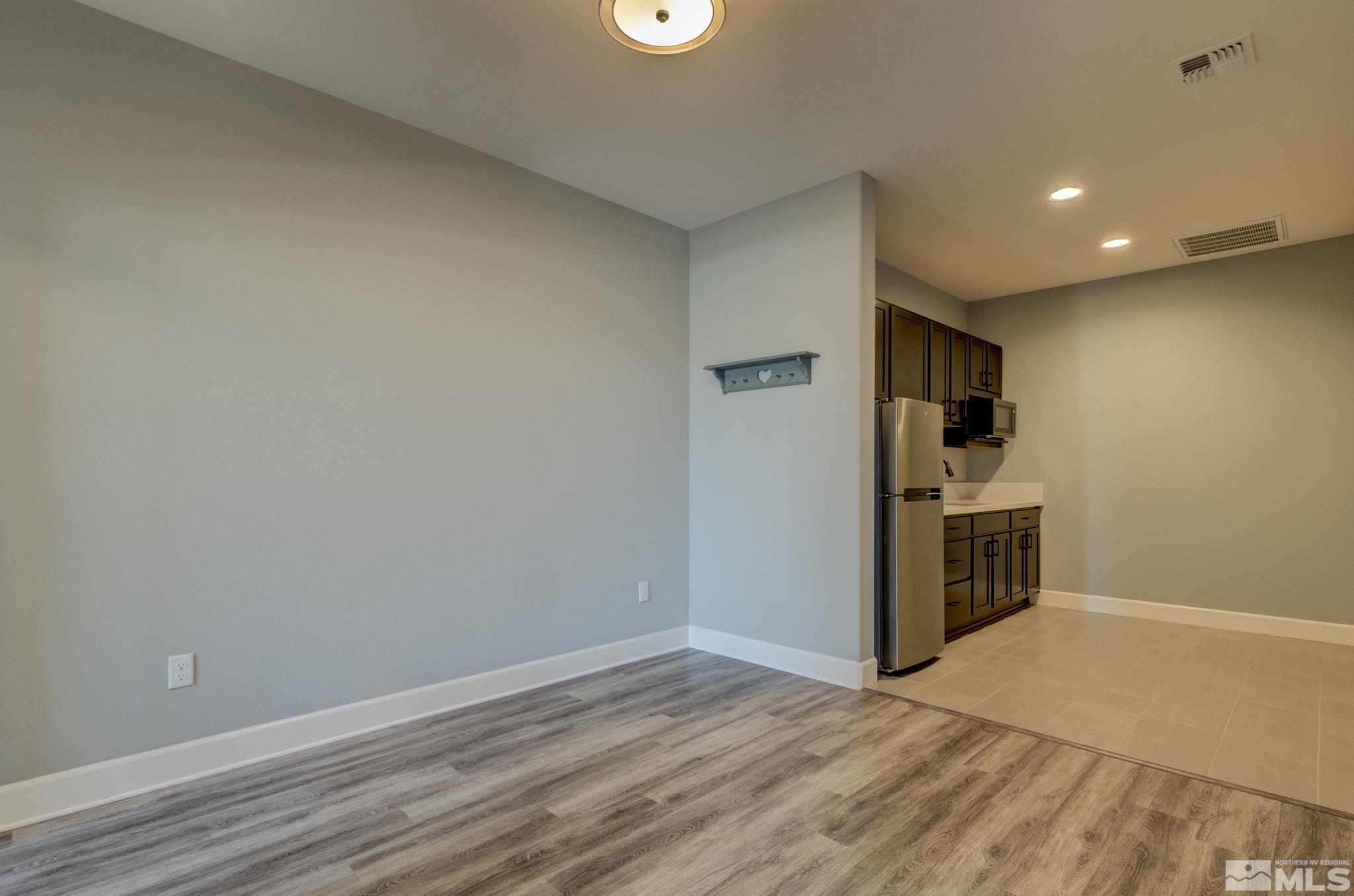607 Riverbed Circle Reno, NV 89521 - Photo 18 of 40 a view of a kitchen with a sink and a refrigerator