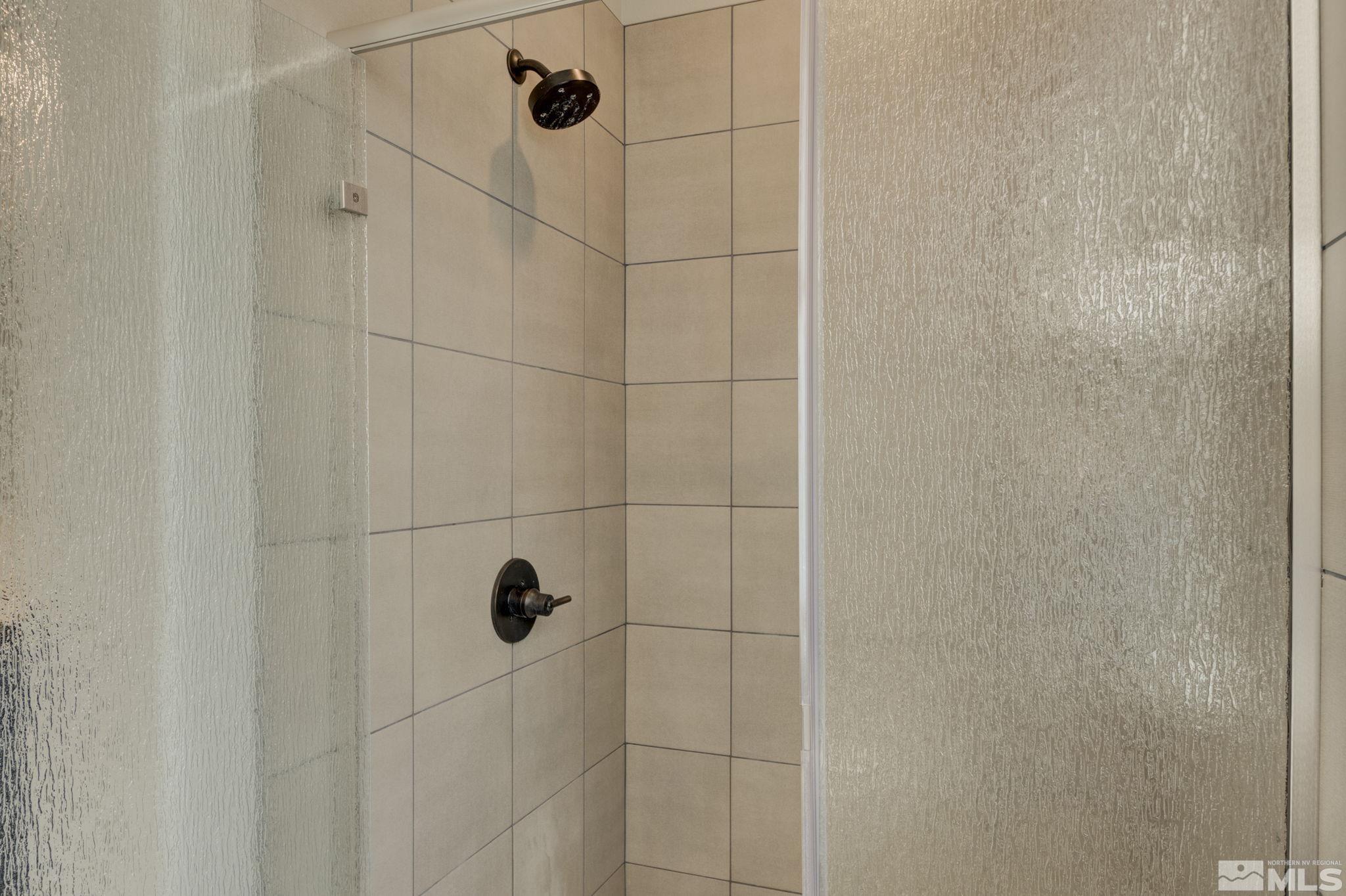 607 Riverbed Circle Reno, NV 89521 - Photo 26 of 40 a bathroom with a shower