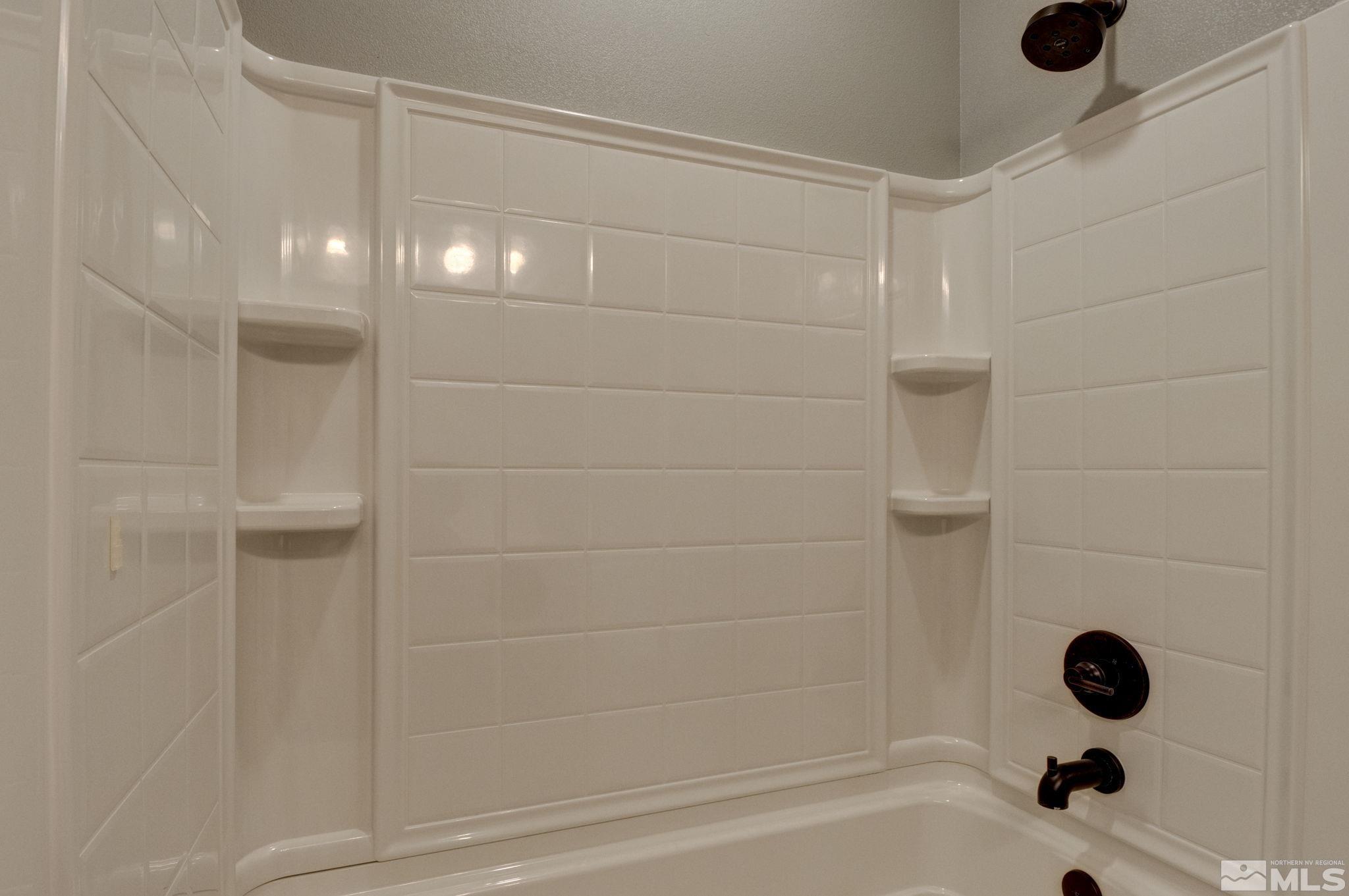 607 Riverbed Circle Reno, NV 89521 - Photo 30 of 40 a bathroom with a shower