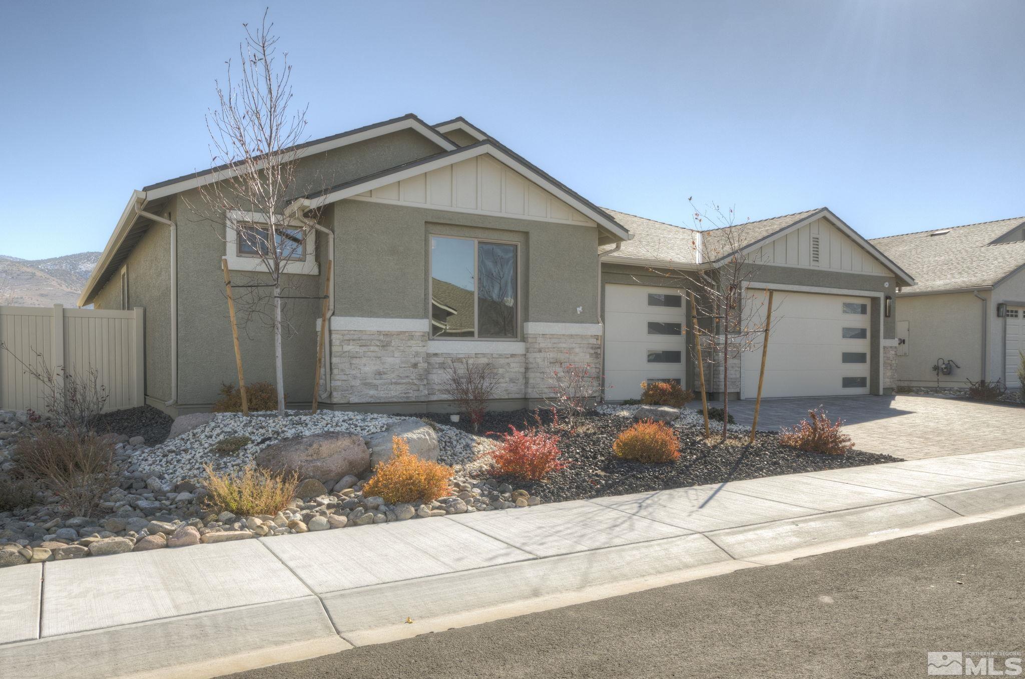 607 Riverbed Circle Reno, NV 89521 - Photo 3 of 40 a front view of a house with patio
