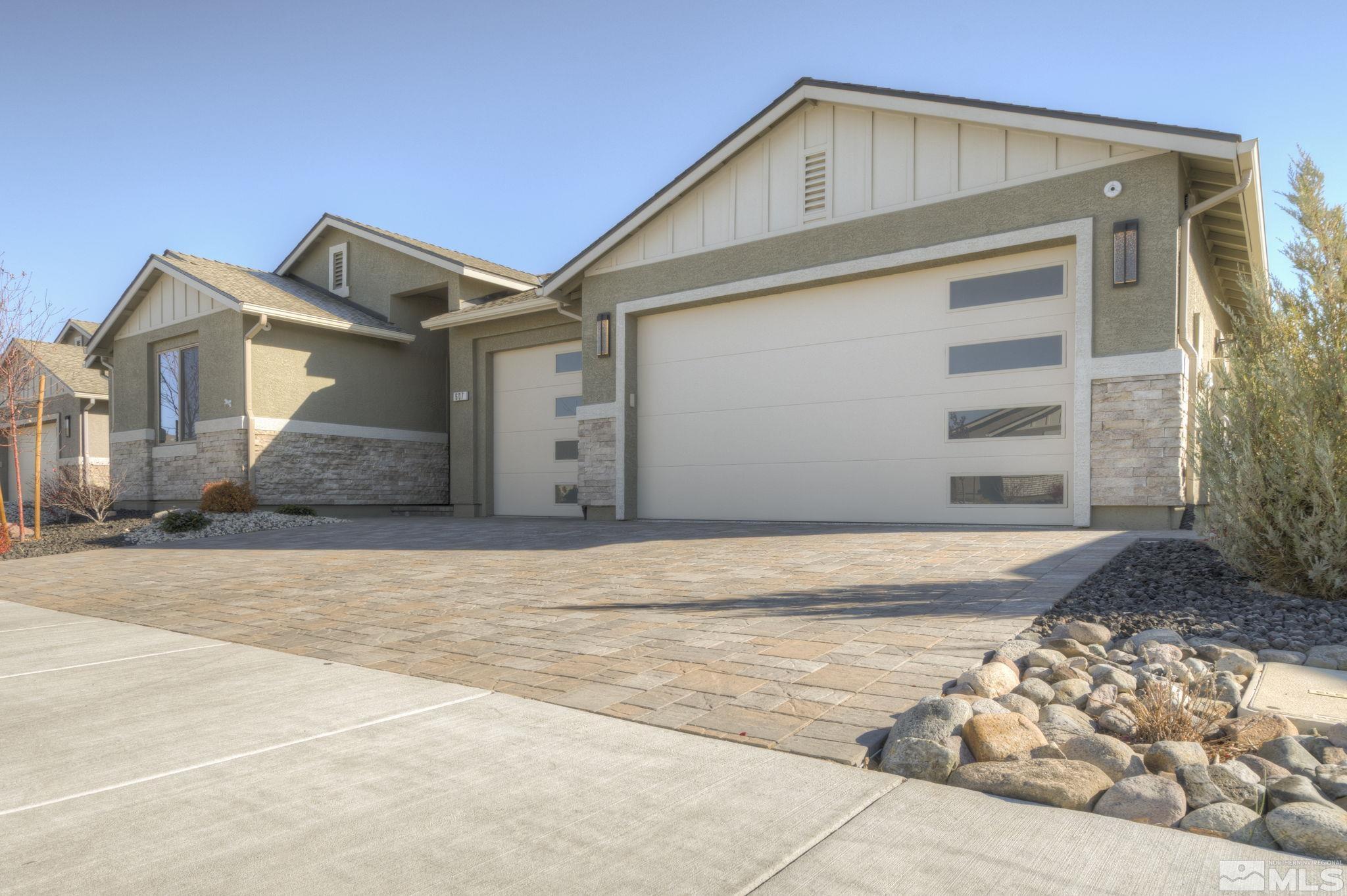 607 Riverbed Circle Reno, NV 89521 - Photo 4 of 40 a view of a house with a yard