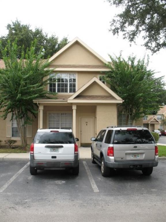 834 Grand Regency Pointe, Unit 202 Altamonte Springs, FL 32714 - Photo 1 of 1 a car parked in front of a house