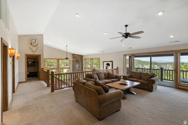 755 South Zion Ridge Drive Orderville, UT 84758 - Photo 52 of 84 Living area with ceiling fan, light colored carpet, recessed lighting, lofted ceiling, and a mountain view