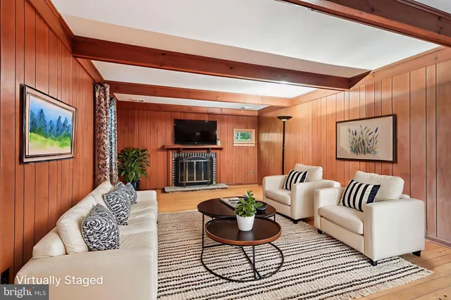 a living room with furniture and a rug