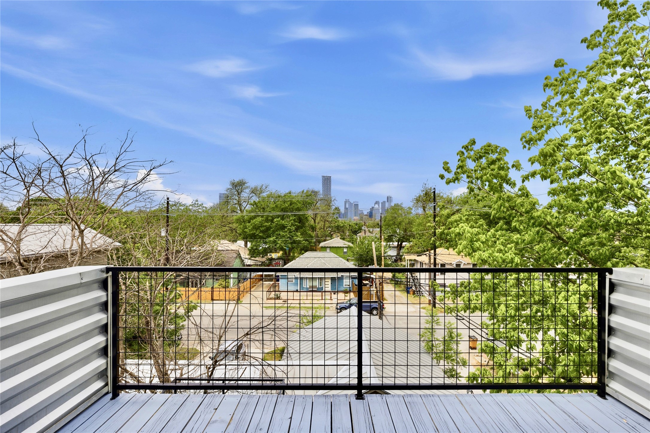 2202 Willow Street, Unit B Austin, TX 78702 - Photo 19 of 21 Wooden terrace featuring a skyline view