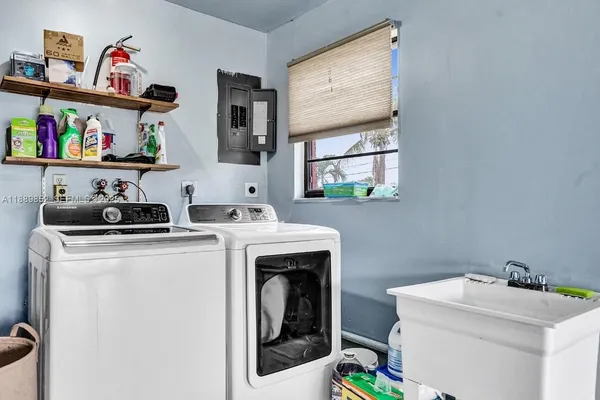 a utility room with dryer and washer