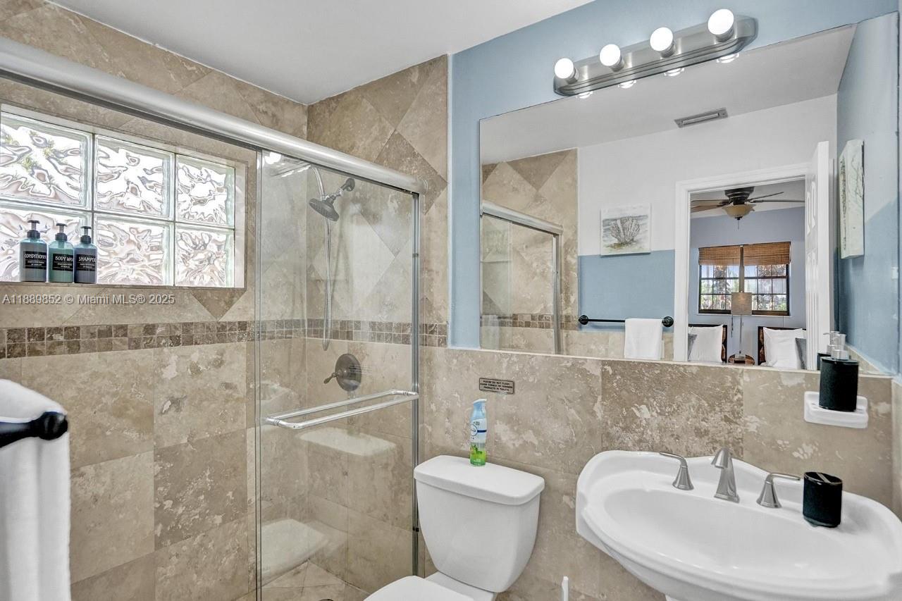 208 Southwest 2nd Avenue Hallandale Beach, FL 33009 - Photo 16 of 28 a bathroom with a toilet a sink and bathtub