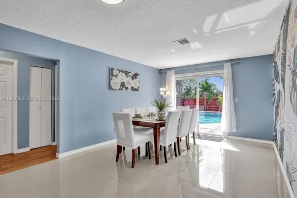 a view of a dining room with furniture window and outside view